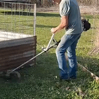 Demonstration of handle placement while trimming along a fence line